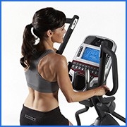woman using elliptical machine