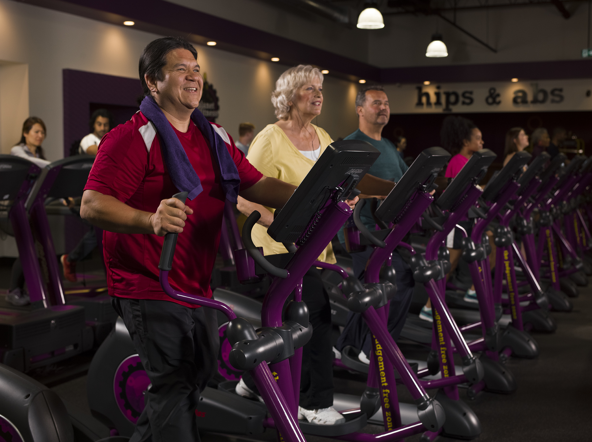group of people doing Elliptical exercise machine