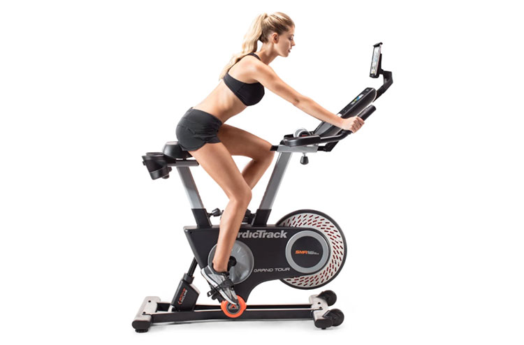Woman using NordicTrack Grand Tour